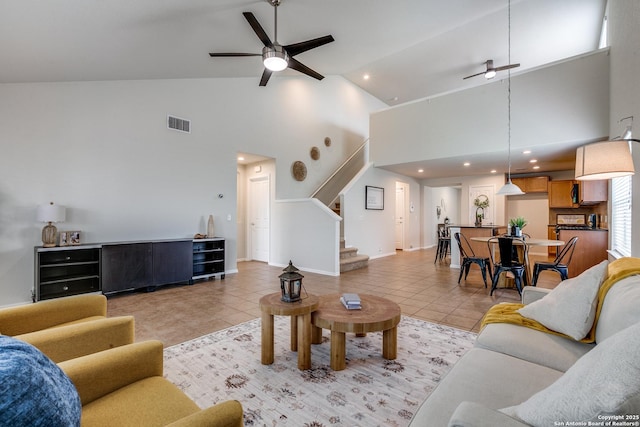 10907 Shoo Fly, San Antonio, TX 78245 - living area with ceiling fan, high vaulted ceiling, light tile patterned floors, stairway, and recessed lighting