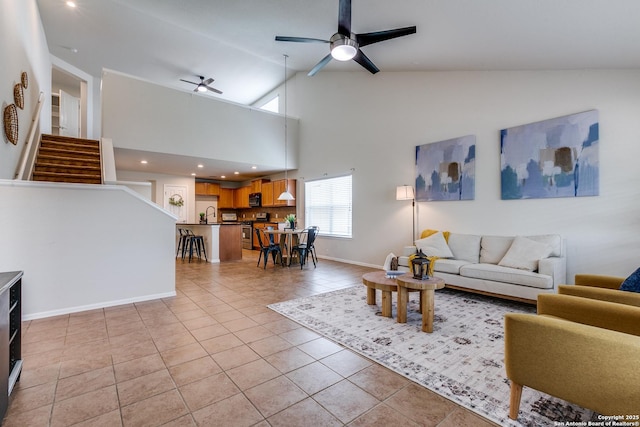 10907 Shoo Fly, San Antonio, TX 78245 - living room with light tile patterned flooring, a ceiling fan, high vaulted ceiling, stairs, and recessed lighting