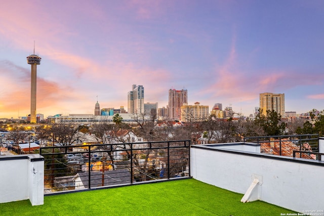 310 S Mesquite St Unit 102, San Antonio, TX 78203 - yard at dusk with a view of skyline and a balcony