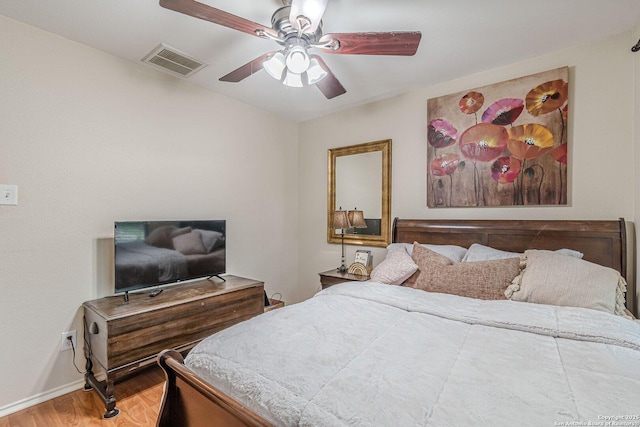 9215 Hilltop Xing, San Antonio, TX 78251 - bedroom featuring wood finished floors, baseboards, and a ceiling fan