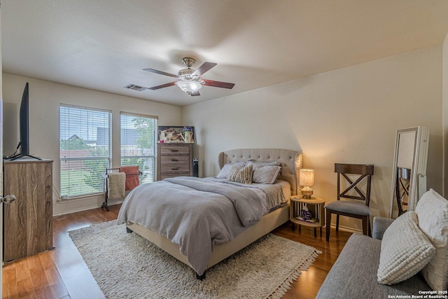 9215 Hilltop Xing, San Antonio, TX 78251 - bedroom featuring light wood finished floors, a ceiling fan, and baseboards