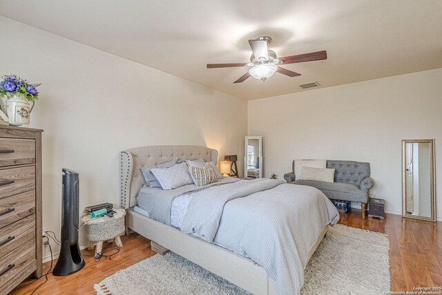 9215 Hilltop Xing, San Antonio, TX 78251 - bedroom featuring light wood-style flooring and a ceiling fan