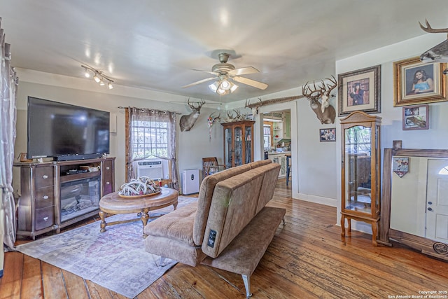 935 Gembler, San Antonio, TX 78219 - living area with ceiling fan, hardwood / wood-style floors, cooling unit, and baseboards