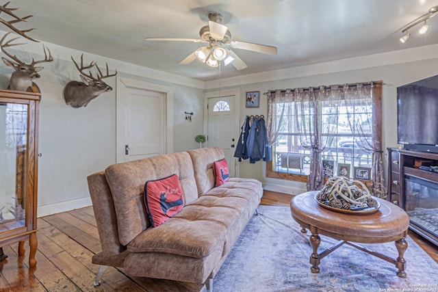 935 Gembler, San Antonio, TX 78219 - living area featuring hardwood / wood-style floors, a ceiling fan, and baseboards