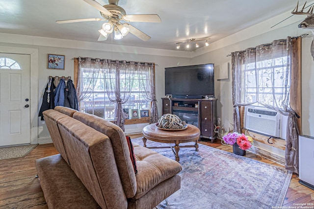 935 Gembler, San Antonio, TX 78219 - living area featuring a ceiling fan, wood finished floors, and cooling unit