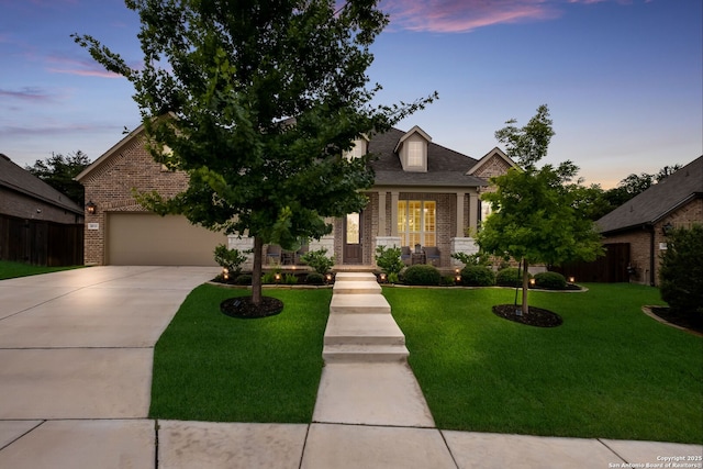 28515 Vogelsdorf, Boerne, TX 78006 - view of front of property with brick siding, concrete driveway, a front lawn, a porch, and a garage