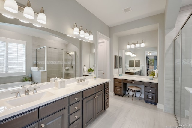 28515 Vogelsdorf, Boerne, TX 78006 - bathroom featuring a stall shower, double vanity, healthy amount of natural light, and a garden tub