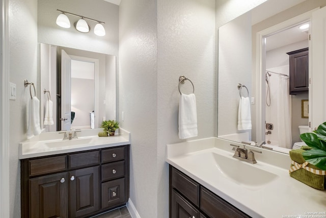 28515 Vogelsdorf, Boerne, TX 78006 - bathroom with toilet, vanity, and curtained shower