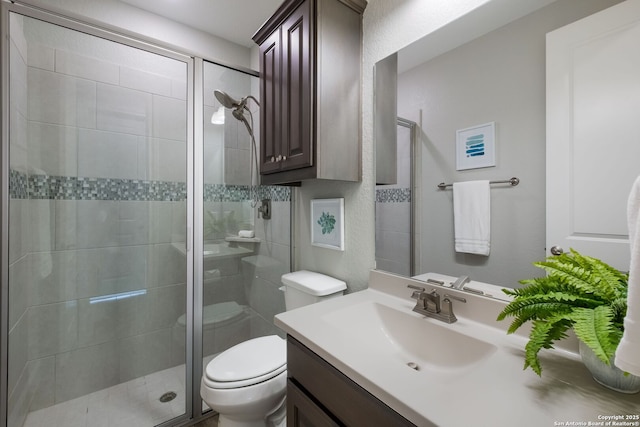 28515 Vogelsdorf, Boerne, TX 78006 - bathroom featuring vanity, a stall shower, and toilet