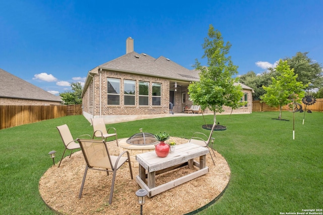 28515 Vogelsdorf, Boerne, TX 78006 - rear view of property with brick siding, a fire pit, a chimney, and a shingled roof