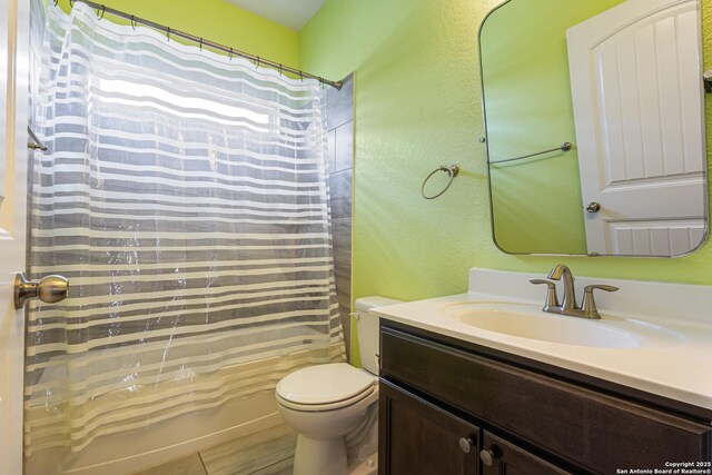 15122 Cinnamon Teal, San Antonio, TX 78253 - bathroom featuring toilet, vanity, a textured wall, and shower / bath combination with curtain