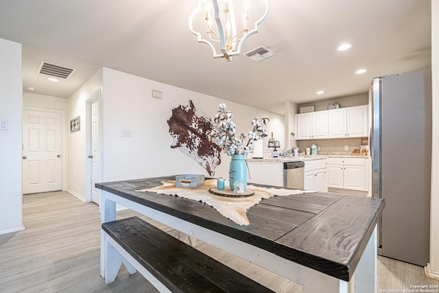 14616 Stable Spgs, Elmendorf, TX 78112 - dining area with a chandelier, light wood-style flooring, baseboards, and recessed lighting