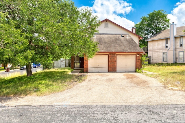 7026 Elmbank, San Antonio, TX 78244 - view of front of property with concrete driveway, brick siding, a shingled roof, and a garage