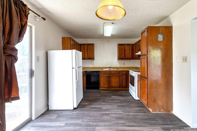 7026 Elmbank, San Antonio, TX 78244 - kitchen with white appliances, a sink, brown cabinetry, a textured ceiling, and under cabinet range hood