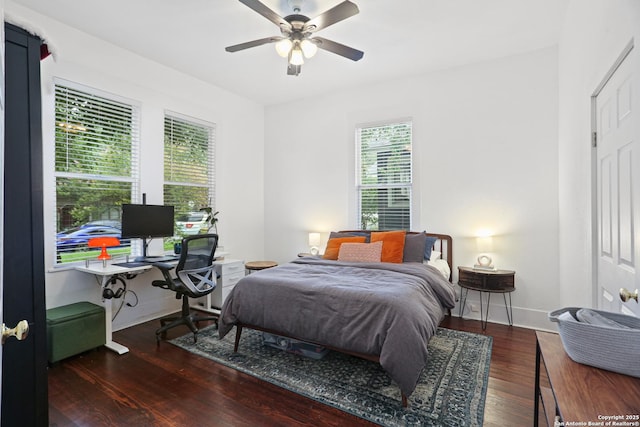 1106 W Summit Ave, San Antonio, TX 78201 - bedroom with wood finished floors, a desk, baseboards, and a ceiling fan