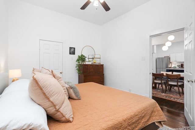 1106 W Summit Ave, San Antonio, TX 78201 - bedroom featuring freestanding refrigerator, dark wood-type flooring, a ceiling fan, and a high ceiling