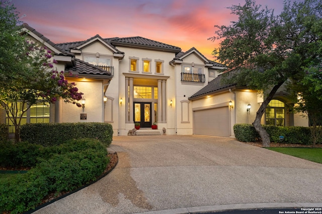 21302 Ronda De Cadiz, San Antonio, TX 78257 - mediterranean / spanish-style home featuring driveway, a tiled roof, french doors, an attached garage, and a balcony