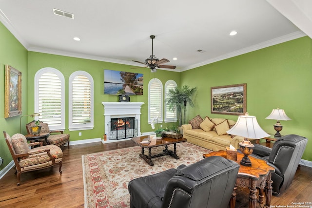 21302 Ronda De Cadiz, San Antonio, TX 78257 - living room featuring ceiling fan, wood finished floors, baseboards, ornamental molding, and recessed lighting