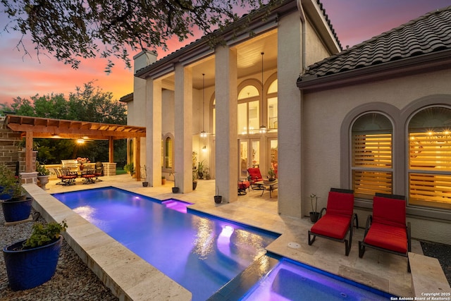 21302 Ronda De Cadiz, San Antonio, TX 78257 - pool at dusk with french doors, a pergola, a patio, and an outdoor pool