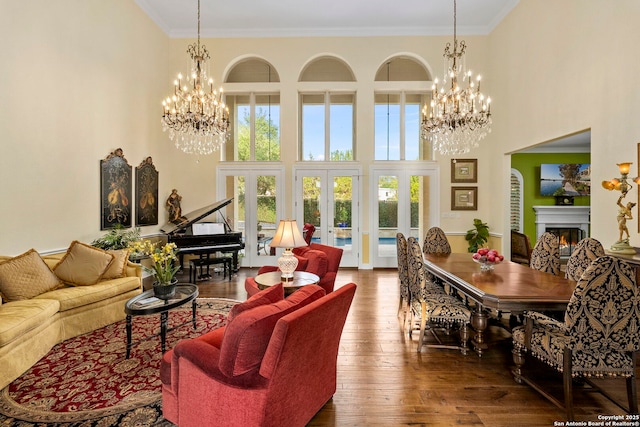 21302 Ronda De Cadiz, San Antonio, TX 78257 - living area with a chandelier, hardwood / wood-style flooring, french doors, ornamental molding, and a high ceiling