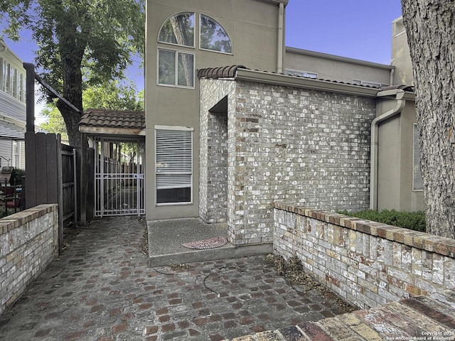 201 Craig Pl Apt B, San Antonio, TX 78212 - doorway to property with a gate and stucco siding