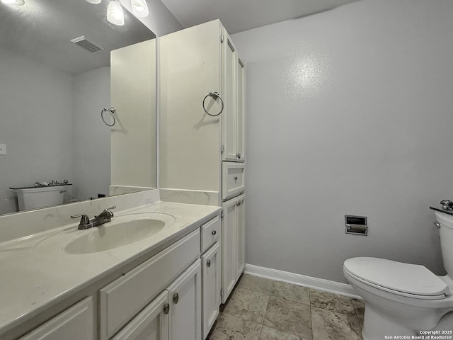 201 Craig Pl Apt B, San Antonio, TX 78212 - bathroom with toilet, vanity, and baseboards
