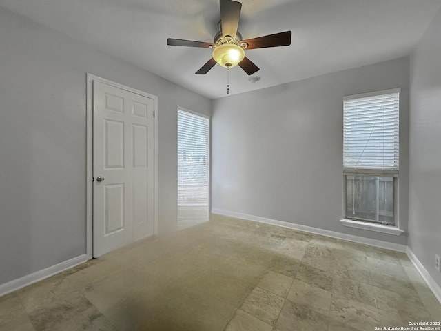 201 Craig Pl Apt B, San Antonio, TX 78212 - empty room featuring baseboards and a ceiling fan