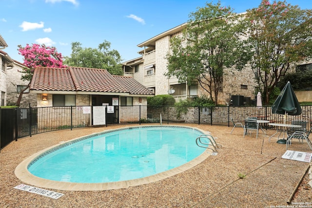 7738 Chambers Rd Unit 1203, San Antonio, TX 78229 - community pool with a patio area
