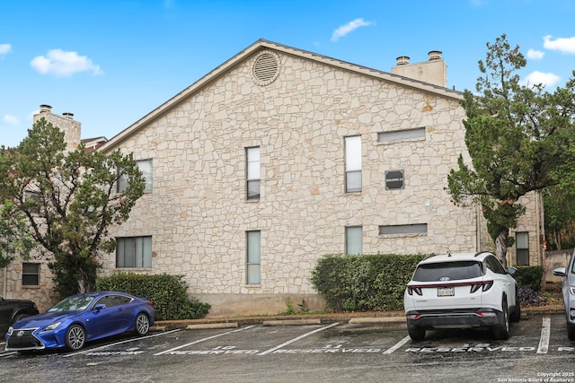 7738 Chambers Rd Unit 1203, San Antonio, TX 78229 - view of building exterior with uncovered parking