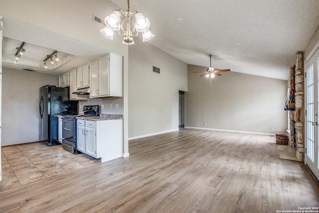 3030 Heidi St, San Antonio, TX 78247 - kitchen with black appliances, a textured ceiling, vaulted ceiling, under cabinet range hood, and white cabinetry