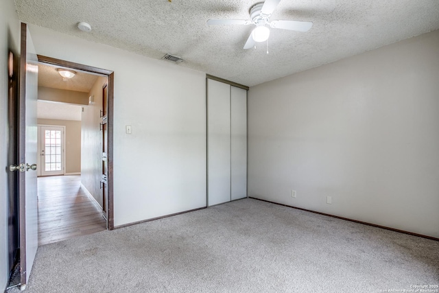 3030 Heidi St, San Antonio, TX 78247 - unfurnished bedroom with carpet, a textured ceiling, a closet, a ceiling fan, and baseboards