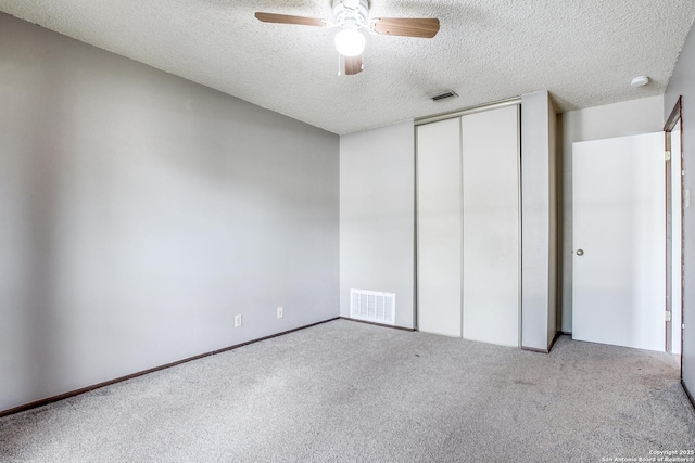 3030 Heidi St, San Antonio, TX 78247 - unfurnished bedroom with carpet floors, a textured ceiling, a closet, and a ceiling fan