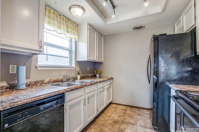 3030 Heidi St, San Antonio, TX 78247 - kitchen with black appliances, a sink, a textured ceiling, white cabinets, and track lighting