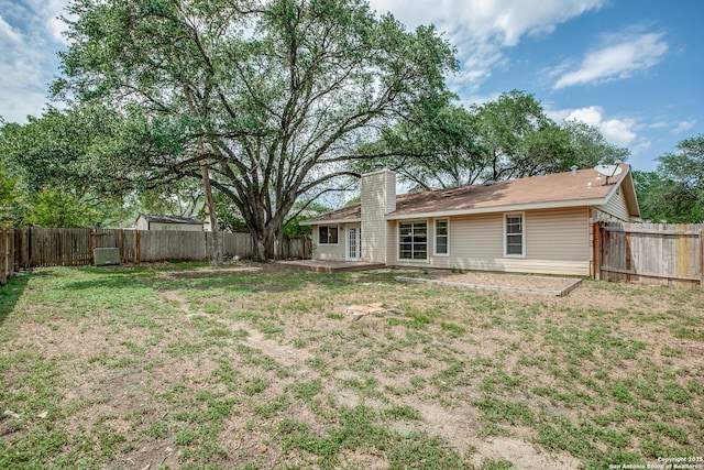 3030 Heidi St, San Antonio, TX 78247 - rear view of house featuring a chimney