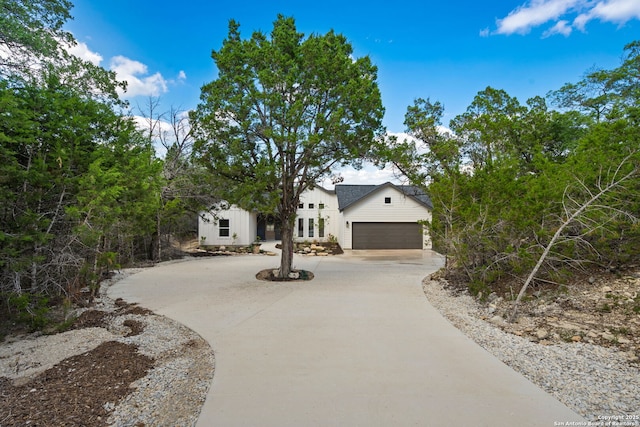 604 Compass Rose, Canyon Lake, TX 78133 - modern farmhouse with curved driveway, a garage, and french doors