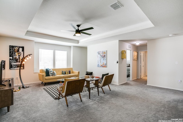 9910 Cowboy Ln, San Antonio, TX 78254 - living room with a raised ceiling, ceiling fan, carpet flooring, and baseboards