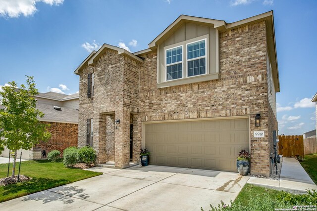 9910 Cowboy Ln, San Antonio, TX 78254 - view of front facade featuring brick siding, an attached garage, and driveway