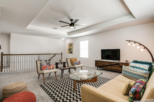 9910 Cowboy Ln, San Antonio, TX 78254 - carpeted living area featuring a tray ceiling, ceiling fan, and crown molding