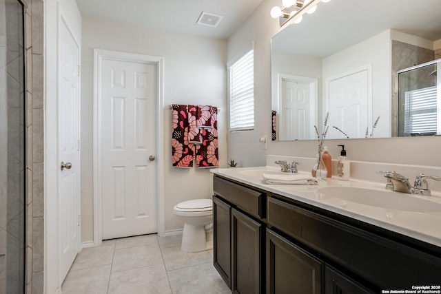 9910 Cowboy Ln, San Antonio, TX 78254 - full bathroom featuring double vanity, plenty of natural light, a tile shower, and tile patterned flooring