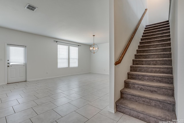9910 Cowboy Ln, San Antonio, TX 78254 - stairway with healthy amount of natural light, tile patterned flooring, a chandelier, and baseboards
