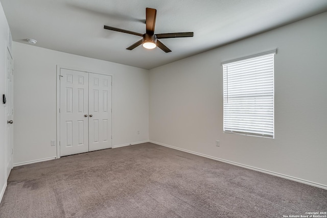 9910 Cowboy Ln, San Antonio, TX 78254 - unfurnished bedroom with carpet, a closet, a ceiling fan, and baseboards
