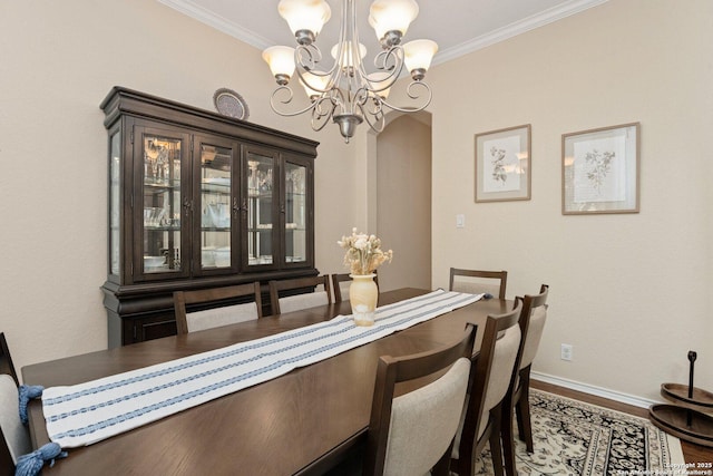 19426 Desert Oak, San Antonio, TX 78258 - dining room featuring a chandelier, wood finished floors, and crown molding