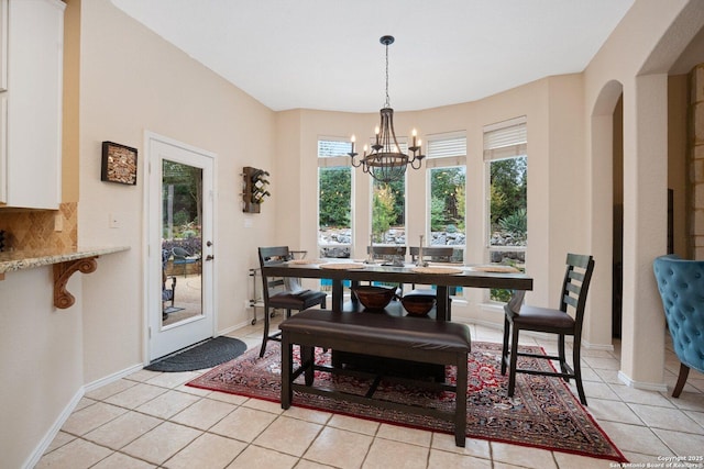 19426 Desert Oak, San Antonio, TX 78258 - dining room featuring a chandelier, light tile patterned flooring, and arched walkways