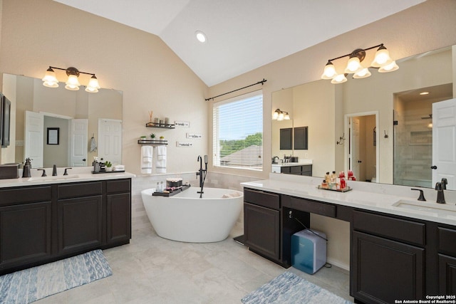 19426 Desert Oak, San Antonio, TX 78258 - full bath featuring two vanities, a freestanding tub, a shower stall, and high vaulted ceiling