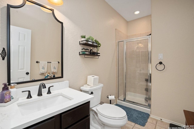 19426 Desert Oak, San Antonio, TX 78258 - full bath with vanity, a shower stall, tile patterned floors, and recessed lighting