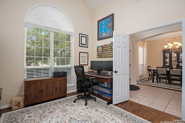 19426 Desert Oak, San Antonio, TX 78258 - home office featuring a chandelier, arched walkways, wood finished floors, lofted ceiling, and plenty of natural light