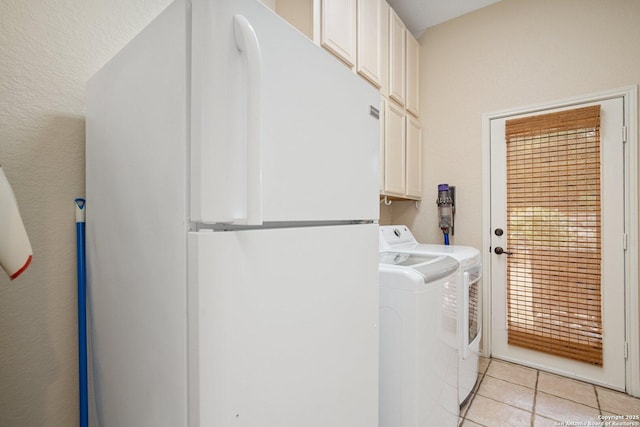 19426 Desert Oak, San Antonio, TX 78258 - washroom with washing machine and dryer, cabinet space, and light tile patterned flooring