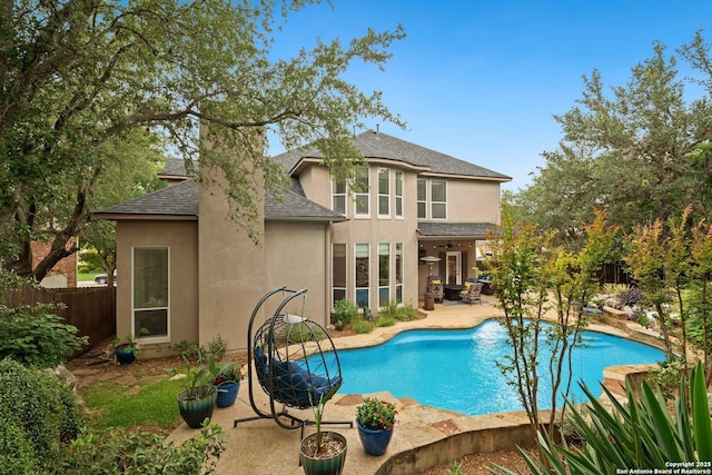 19426 Desert Oak, San Antonio, TX 78258 - rear view of property with a shingled roof, a patio, stucco siding, and a chimney