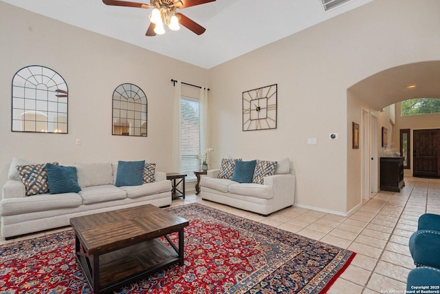 19426 Desert Oak, San Antonio, TX 78258 - living area featuring a ceiling fan, light tile patterned floors, and arched walkways