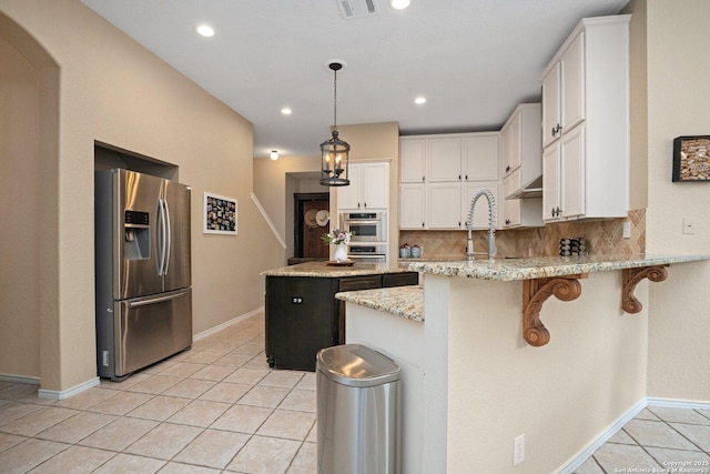 19426 Desert Oak, San Antonio, TX 78258 - kitchen with stainless steel fridge with ice dispenser, a peninsula, light tile patterned floors, white cabinetry, and recessed lighting